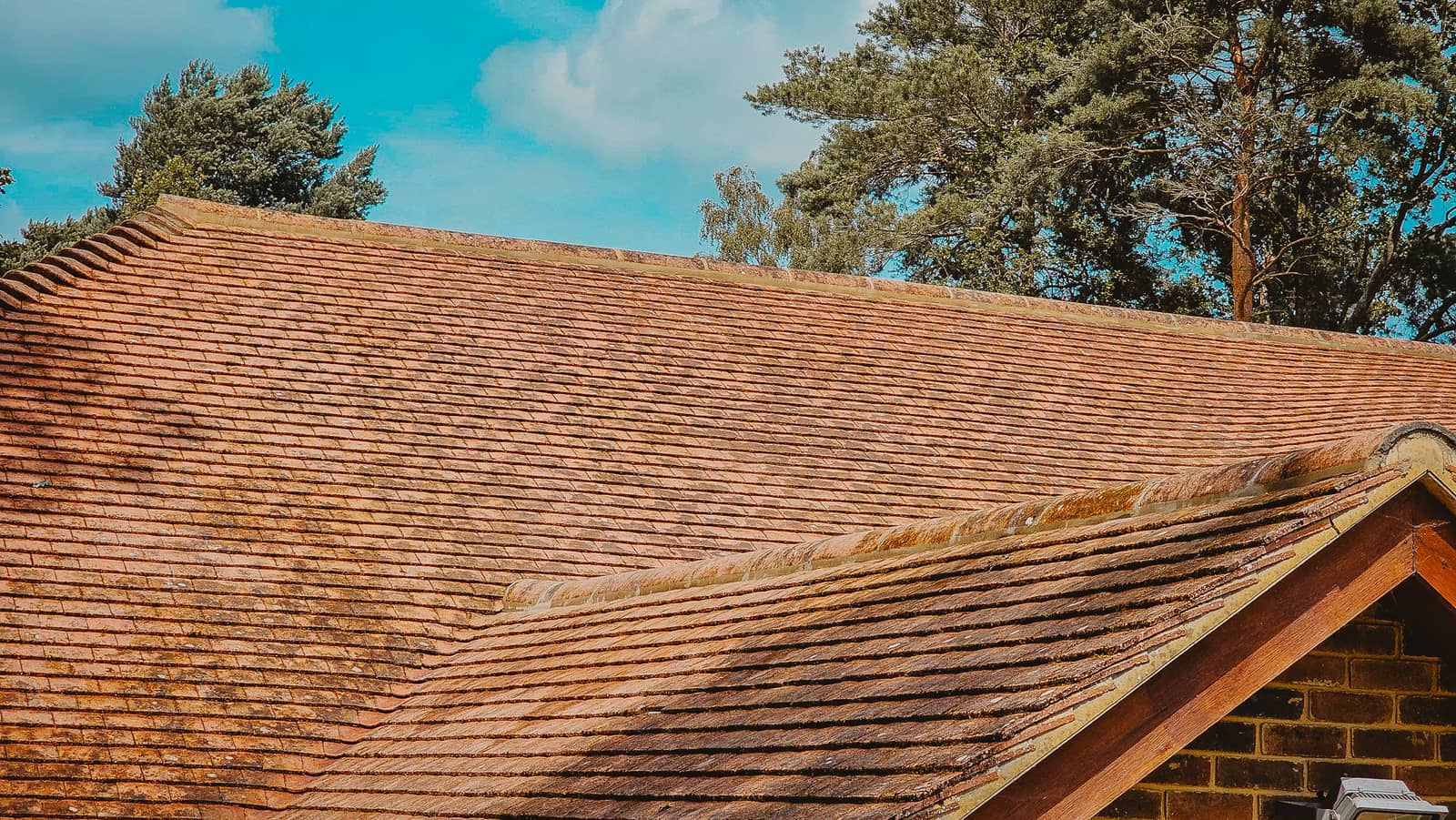Finished lead valley flashing between slate roof slopes