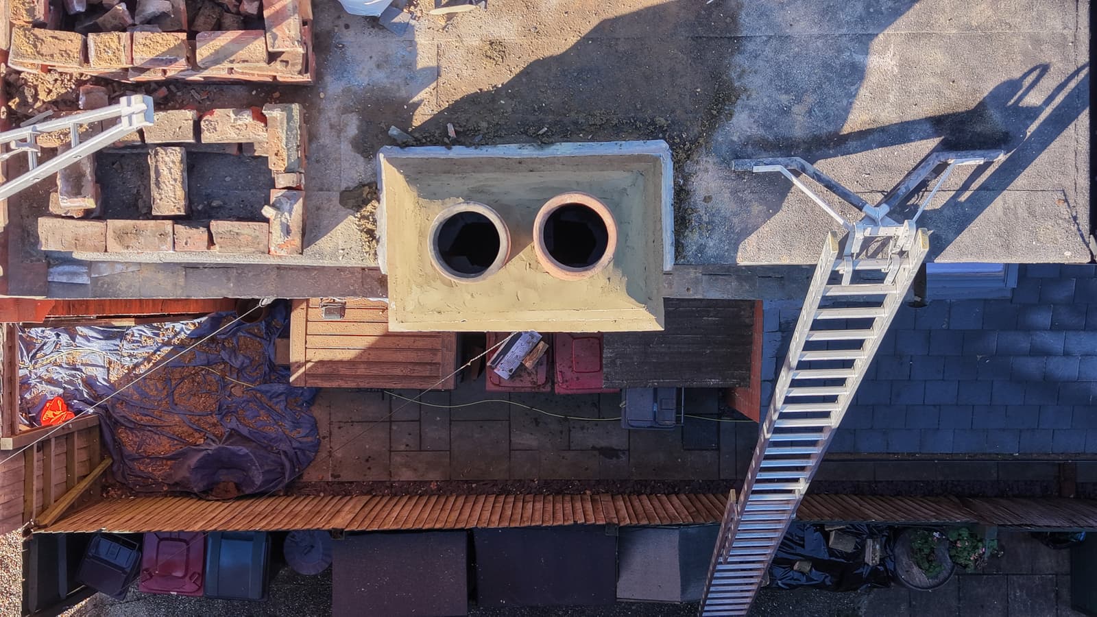 Aerial view of a residential roof and chimney stack
