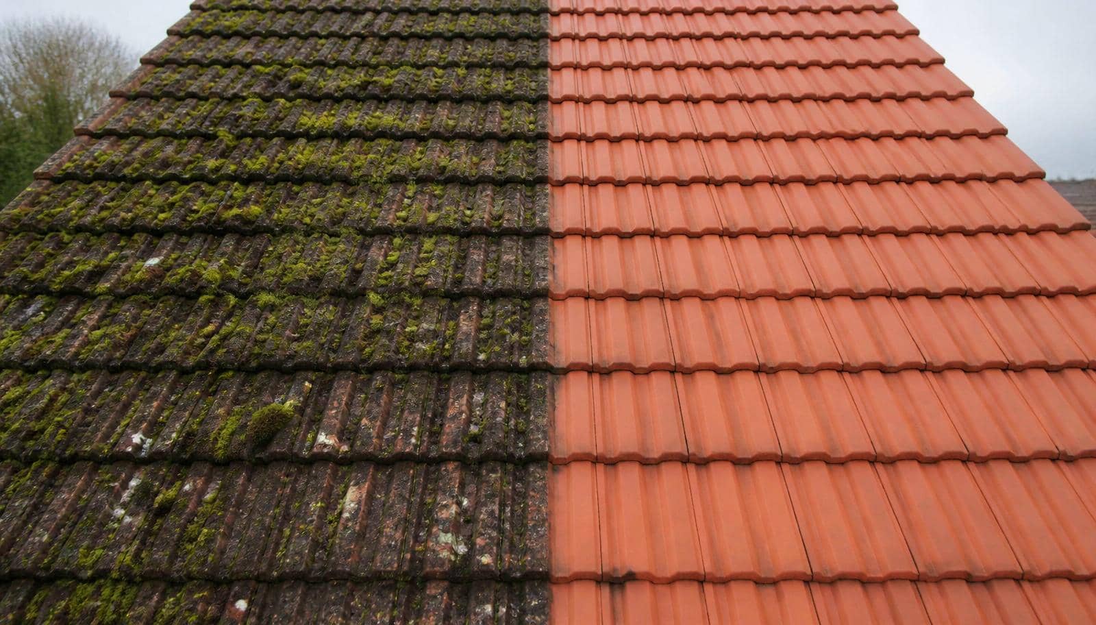 Roof cleaning work on a residential tiled roof